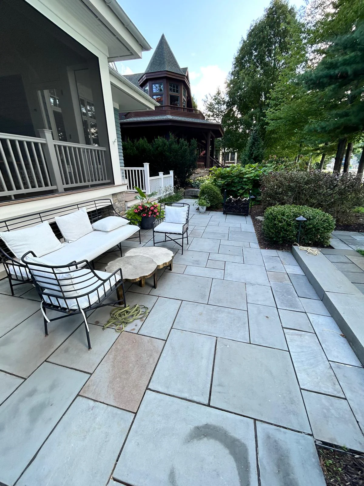 Natural bluestone patio with level surface and tight joints