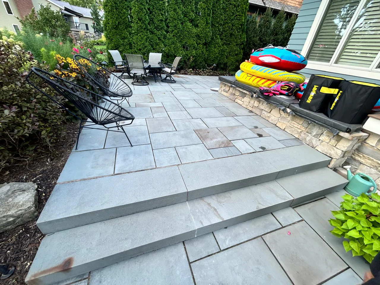 Wide view of a finished bluestone patio