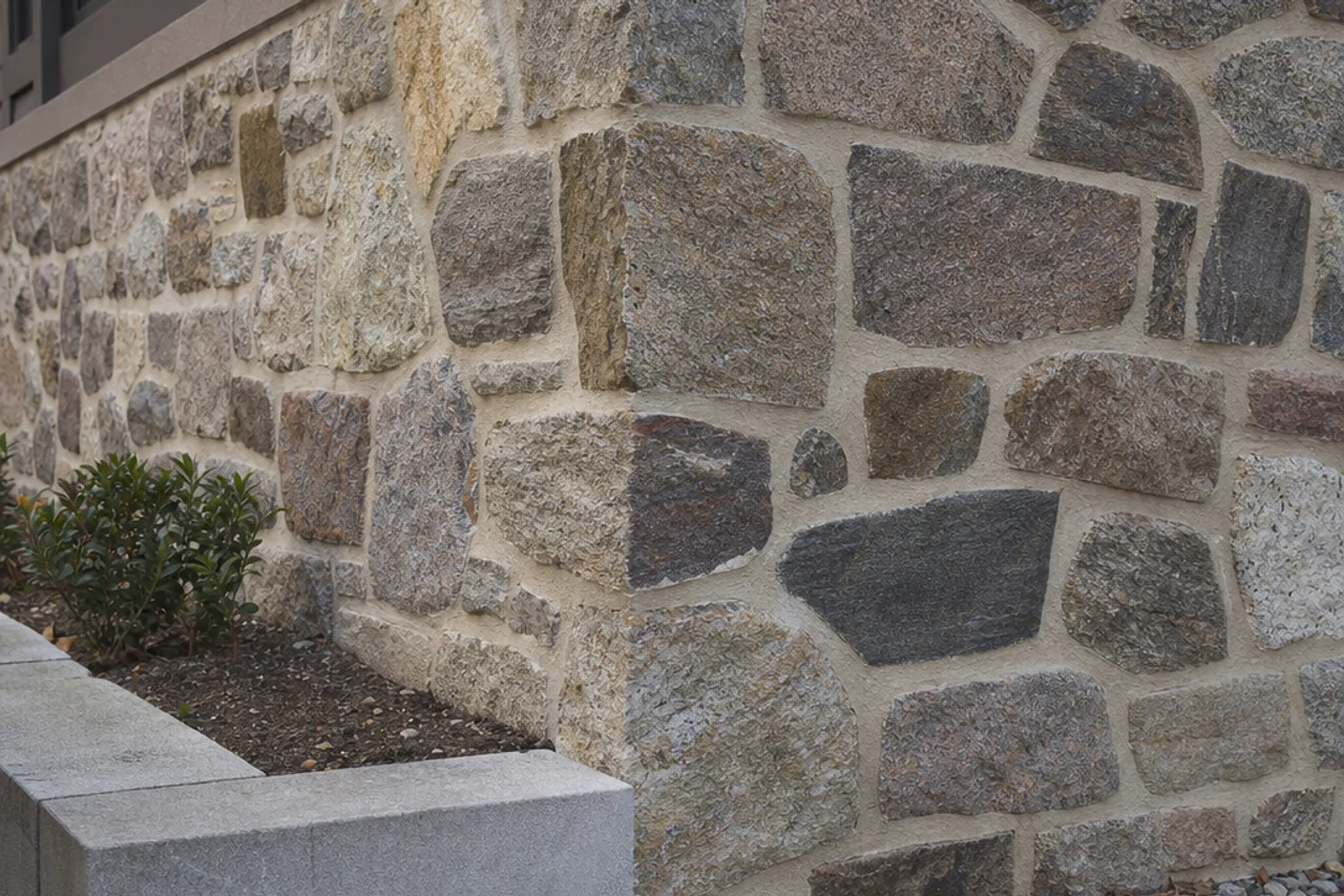 Restored historic fieldstone foundation with compatible light mortar and original stones retained